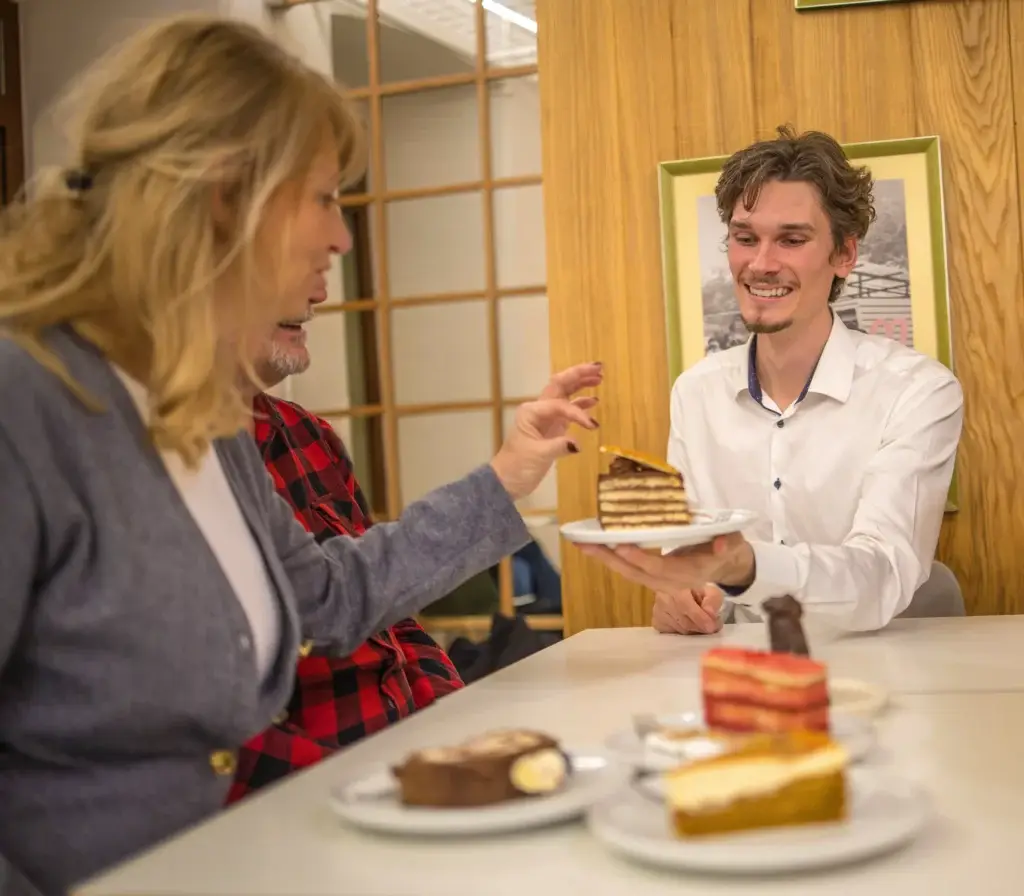 Travelers tasting traditional Slovak pastries during a Go Bratislava Cakes & Pastry Tour.
