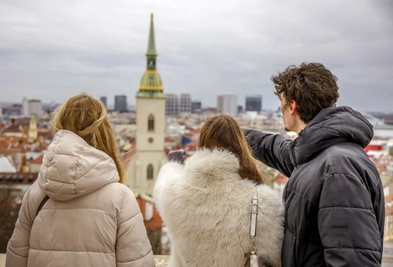 Guests taking photos of St. Martin's Cathedral from a viewpoint in Bratislava
