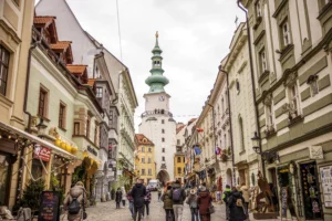 Michael's Gate tower above a busy street in Bratislava Old Town